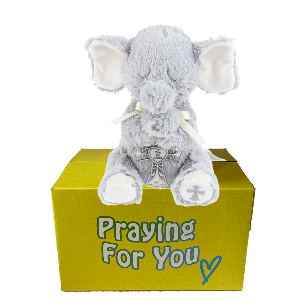 Enzo the gray plush elephant praying toy on a yellow box with 'Praying For You' text.  Christian baby keepsake at sendapraynow.com Enzo the gray plush elephant praying toy on a yellow box with 'Praying For You' text.  Christian baby keepsake at sendapraynow.com