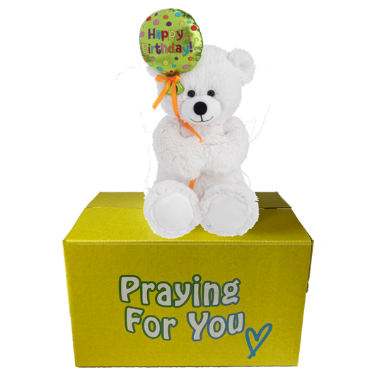 white happy birthday  teddy bear with balloon in hand sitting on yellow box : send a PRAYER